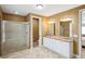 Spacious bathroom with a glass-enclosed shower and a double vanity sink at 1699 E Ashley Ave # B, Folly Beach, SC 29439