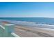 A scenic beach view with gentle waves and clear blue skies, accessible from the property at 1699 E Ashley Ave # B, Folly Beach, SC 29439