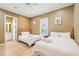 Serene bedroom with two queen beds, bright windows, and warm, inviting decor at 1699 E Ashley Ave # B, Folly Beach, SC 29439