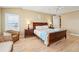 Inviting bedroom with a wooden bed frame and natural light from the window at 1699 E Ashley Ave # B, Folly Beach, SC 29439