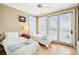 Bright bedroom with twin beds and direct access to an ocean view balcony at 1699 E Ashley Ave # B, Folly Beach, SC 29439