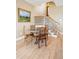 Cozy breakfast nook with seating for four next to a staircase and featuring natural light at 1699 E Ashley Ave # B, Folly Beach, SC 29439