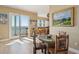 Dining area with seating for four featuring views of the ocean and seamless flow to the kitchen at 1699 E Ashley Ave # B, Folly Beach, SC 29439