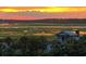 Charming coastal home overlooking marshland, enhanced by a vibrant sunset at 1699 E Ashley Ave # B, Folly Beach, SC 29439