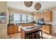 Gourmet kitchen features custom cabinets, granite counters, a center island, and amazing ocean views at 1699 E Ashley Ave # B, Folly Beach, SC 29439