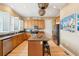 Open-concept kitchen featuring stainless appliances, a center island, and custom cabinets at 1699 E Ashley Ave # B, Folly Beach, SC 29439