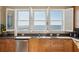 Bright kitchen featuring stainless steel appliances, granite counters, and a sink with ocean views at 1699 E Ashley Ave # B, Folly Beach, SC 29439