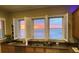 Kitchen with granite counters and stunning ocean views framed by bright white plantation shutters at 1699 E Ashley Ave # B, Folly Beach, SC 29439