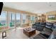 Open living area features ocean views, comfortable seating, and access to a balcony at 1699 E Ashley Ave # B, Folly Beach, SC 29439