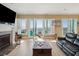 Elegant living room with fireplace, ocean views, and a balcony perfect for enjoying the coastal breeze at 1699 E Ashley Ave # B, Folly Beach, SC 29439