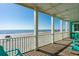 Enjoy beautiful beach views from this porch with comfortable seating and shade at 1699 E Ashley Ave # B, Folly Beach, SC 29439