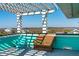Charming rooftop deck furnished with chairs and a pergola, offering stunning water vistas at 1699 E Ashley Ave # B, Folly Beach, SC 29439