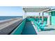 Relaxing rooftop deck with partial pergola, and beach view at 1699 E Ashley Ave # B, Folly Beach, SC 29439