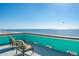 Relax on the rooftop deck with comfortable seating and panoramic ocean views on a sunny day at 1699 E Ashley Ave # B, Folly Beach, SC 29439