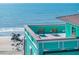Rooftop patio with seating and ocean view, offering a serene escape with stunning coastal scenery at 1699 E Ashley Ave # B, Folly Beach, SC 29439