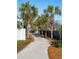 Charming tree-lined street with a paved pathway leading to the beach homes, offering a peaceful setting at 1699 E Ashley Ave # B, Folly Beach, SC 29439