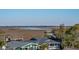 Picturesque water view featuring marshes and distant bridges near residential homes at 1699 E Ashley Ave # B, Folly Beach, SC 29439