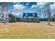 Attractive two-story home with a red-brick foundation, dormer windows, and a green lawn at 1898 Hialeah Ct, Charleston, SC 29414