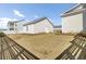 Backyard showing detached garage, green grass, and privacy fence at 201 Symphony Ave, Summerville, SC 29486