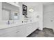 Stylish bathroom with dual vanity, white cabinets, and sleek countertops at 201 Symphony Ave, Summerville, SC 29486