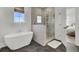 Modern bathroom featuring a freestanding tub, glass shower, and black hexagonal tile floor at 201 Symphony Ave, Summerville, SC 29486