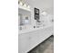 Chic bathroom with dual sinks, white cabinets, and modern fixtures at 201 Symphony Ave, Summerville, SC 29486