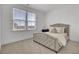 Bright bedroom with neutral tones, plush carpeting, and large windows at 201 Symphony Ave, Summerville, SC 29486