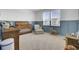 Cozy Bedroom with ample natural light, rocking horse, and baby furniture at 201 Symphony Ave, Summerville, SC 29486