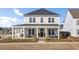 Charming two-story home with a welcoming front porch and manicured landscaping at 201 Symphony Ave, Summerville, SC 29486