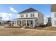 Beautiful home with a wide front porch and a well-maintained lawn at 201 Symphony Ave, Summerville, SC 29486