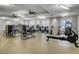 Bright fitness center equipped with cardio machines and weights for residents at 201 Symphony Ave, Summerville, SC 29486