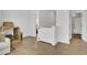 Bright hallway with hardwood floors, white walls and trim, with a glimpse into a nearby bathroom at 201 Symphony Ave, Summerville, SC 29486