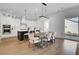 Bright kitchen with stainless steel appliances, a large island, and a dining area at 201 Symphony Ave, Summerville, SC 29486