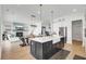 Open concept kitchen with stainless steel appliances and view of the living and dining area at 201 Symphony Ave, Summerville, SC 29486