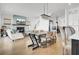 Open concept living area with fireplace, dining table, and stairs at 201 Symphony Ave, Summerville, SC 29486