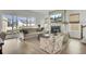 Open living room features a fireplace, large windows, comfortable seating, and natural light at 201 Symphony Ave, Summerville, SC 29486