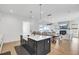 Open concept kitchen featuring a large island with view of the living and dining area at 201 Symphony Ave, Summerville, SC 29486