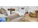 Comfortable main bedroom with plush furniture, a wall-mounted TV, and plenty of natural light at 201 Symphony Ave, Summerville, SC 29486