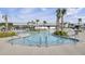 An attractive view of a stylish community pool area, showcasing palm trees and seating at 201 Symphony Ave, Summerville, SC 29486