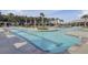 A refreshing view of a pool with clear water, palm trees, and relaxing amenities at 201 Symphony Ave, Summerville, SC 29486