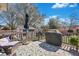 Backyard deck with grill, lawn shed, seating, and decorative outdoor rug at 2029 Country Manor Dr, Mount Pleasant, SC 29466