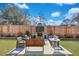 Backyard featuring patio furniture and outdoor fireplace with a mounted television at 2029 Country Manor Dr, Mount Pleasant, SC 29466