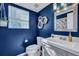 Stylish bathroom with a modern vanity, decorative mirror, and a fresh, clean design; a relaxing retreat at 2029 Country Manor Dr, Mount Pleasant, SC 29466