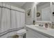 A bathroom featuring a white vanity, toilet, and shower with a patterned shower curtain at 2029 Country Manor Dr, Mount Pleasant, SC 29466