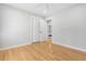 Neutral bedroom with hardwood floors, ceiling fan and a closet, with a view to another room at 209 Brailsford Rd, Summerville, SC 29485