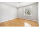 Bright bedroom featuring hardwood floors, a ceiling fan, and a window letting in natural light at 209 Brailsford Rd, Summerville, SC 29485