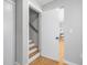 Hallway with hardwood stairs, gray walls, and white trim, leading to the main floor at 209 Brailsford Rd, Summerville, SC 29485