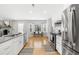 Bright kitchen with granite counters, stainless appliances, and hardwood floors at 209 Brailsford Rd, Summerville, SC 29485