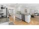 Open kitchen showcasing stainless appliances, granite counters, and sight lines to Gathering room at 209 Brailsford Rd, Summerville, SC 29485