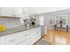 Kitchen with granite counters, stainless appliances, white cabinets and eat-in table at 209 Brailsford Rd, Summerville, SC 29485